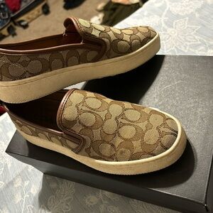 Khaki slip on Coach sneakers. Very comfortable & casual